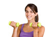 Pretty young woman lifting dumbbells