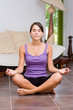 Pretty young woman meditating