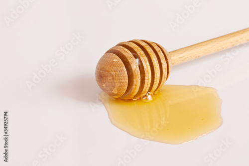 Photo: Honey and wood dipper Honey and wood dipper