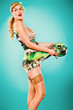 Photo: Excited beautiful woman holding hot casserole in hands. Pin-up Excited beautiful woman holding hot casserole in hands. Pin-up