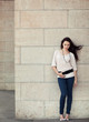 Photo: Full length stylish girl posing on street Full length stylish girl posing on street