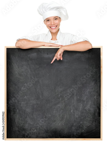 Photo: Chef showing menu sign Chef showing menu sign