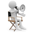 Film director sitting in a chair with a megaphone