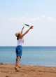 girl playing frisbee