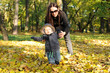 Toddler with mummy in the park in autumn