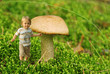 Cute tiny boy playing in the forest