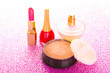 makeup powder on pink background