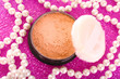 makeup powder on pink background