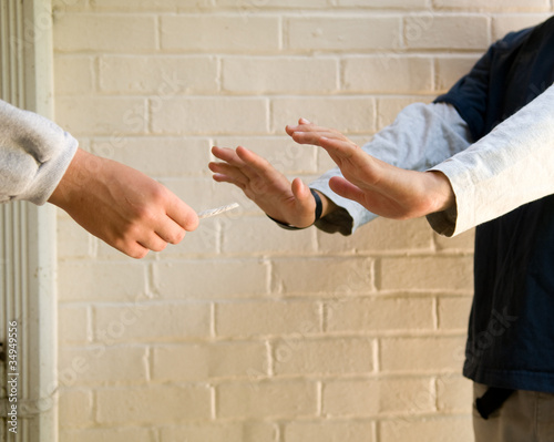 Photo: teen boy refuses marijuana from another boy teen boy refuses marijuana from another boy