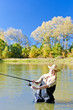 woman fishing in pond