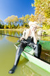 fishing woman sitting on boat