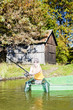 fishing woman sitting on boat