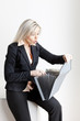 portrait of young businesswoman with folders