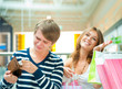 Woman can`t stop shopping at mall, making her man or boyfriend s Woman can`t stop shopping at mall, making her man or boyfriend s
