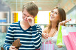 Woman can`t stop shopping at mall, making her man or boyfriend s Woman can`t stop shopping at mall, making her man or boyfriend s