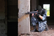 Armed soldier in black mask targeting with a gun Armed soldier in black mask targeting with a gun