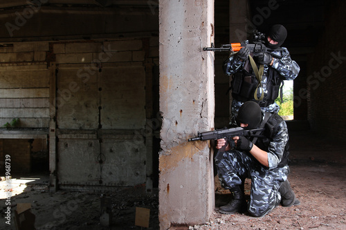 Photo: Two soldiers targeting with guns Two soldiers targeting with guns