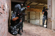 Soldiers in black masks targeting with guns