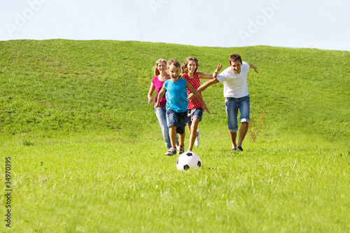 Photo: Parents and kids running Parents and kids running