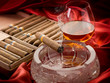 Cuban cigar and liquor over the ash tray Cuban cigar and liquor over the ash tray