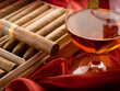 cuban cigar and  liquor  over red satin