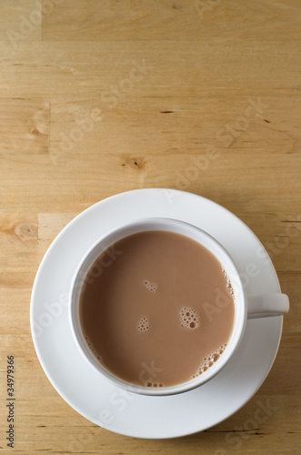 Photo: Cup of Tea on Wooden Table Cup of Tea on Wooden Table
