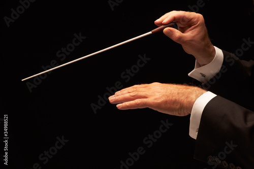 Photo: Conductor conducting an orchestra Conductor conducting an orchestra