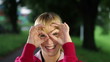 Woman looking through her fingers