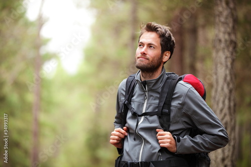 Photo: Hiker - man hiking in forest Hiker - man hiking in forest