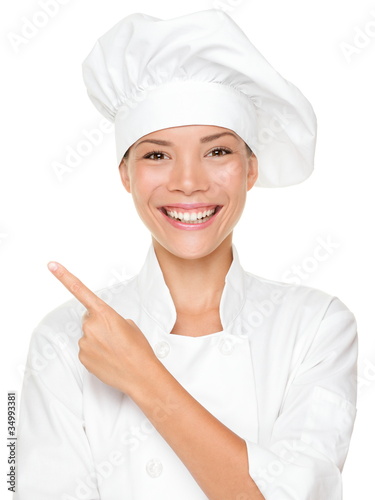 Photo: Woman chef pointing Woman chef pointing