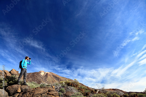 Photo: hiker in dramatic landscape hiker in dramatic landscape