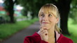 Pensive woman in a park