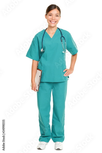 Photo: Nurse standing smiling isolated Nurse standing smiling isolated