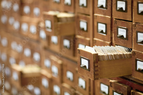 Photo: database concept. vintage cabinet. library card or file catalog. database concept. vintage cabinet. library card or file catalog.