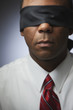 African businessman in blindfold