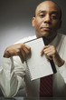 African businessman holding datebook