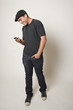 Hispanic teenager listening to mp3 player