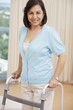 Hispanic woman using walker