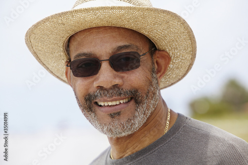 Photo: African man in straw hat smiling African man in straw hat smiling