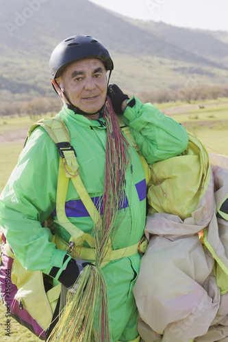 Photo: Senior Hispanic man skydiving Senior Hispanic man skydiving