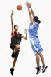 Mixed race women playing basketball
