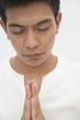 Praying Hispanic man