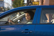 Mixed race woman driving car