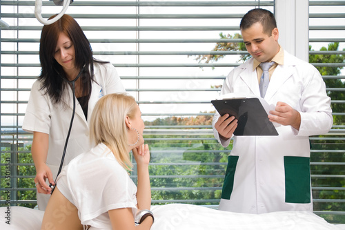 Photo: The nurse stethoscope listens to the patient The nurse stethoscope listens to the patient