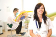 Gynecologist examining the Patient, nurse smiling