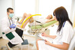 Photo: Gynecologist examining a patient a colposcope Gynecologist examining a patient a colposcope