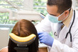 Image of a dentist curing a girl