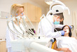 A dentist and a nurse curing