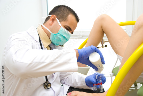 Photo: Doctor during a pelvic examination Doctor during a pelvic examination