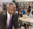 Black librarian in school library